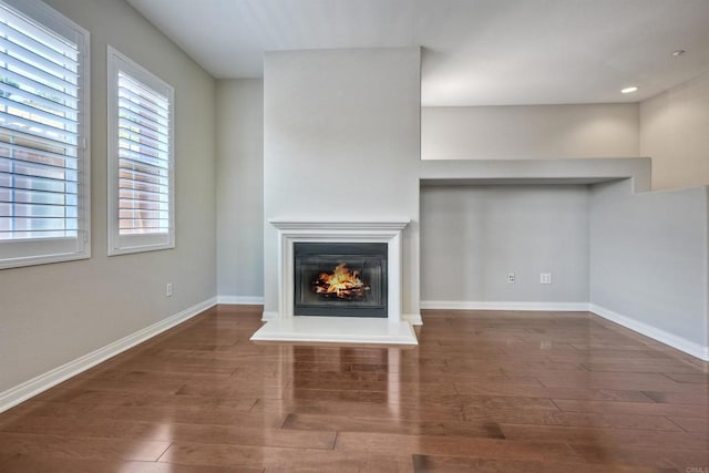 1440 Clearview Way, San Marcos, CA 92078 - unfurnished living room featuring wood finished floors, a glass covered fireplace, and recessed lighting