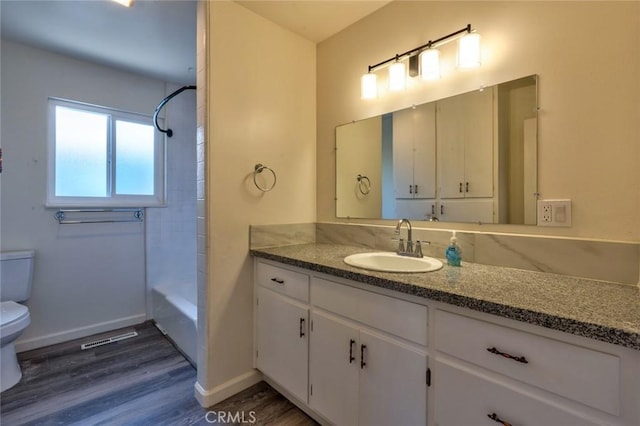 1101 Kensington Dr, Merced, CA 95340 - bathroom featuring vanity, wood finished floors, and shower / bath combination