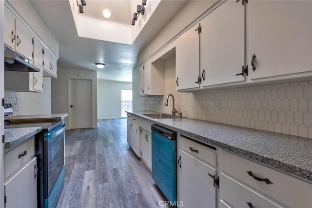 1101 Kensington Dr, Merced, CA 95340 - kitchen featuring under cabinet range hood, range with electric cooktop, dishwashing machine, backsplash, and white cabinets