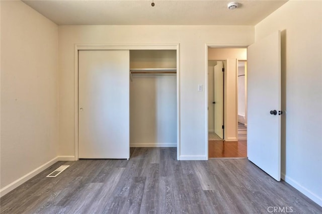 1101 Kensington Dr, Merced, CA 95340 - unfurnished bedroom with wood finished floors and a closet