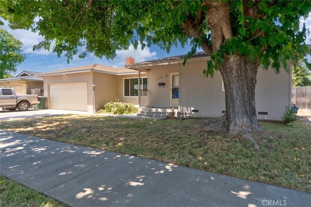 1101 Kensington Dr, Merced, CA 95340 - ranch-style home with crawl space, an attached garage, concrete driveway, and a chimney