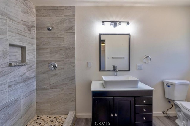 1101 Kensington Dr, Merced, CA 95340 - full bath with tiled shower, vanity, and wood finished floors