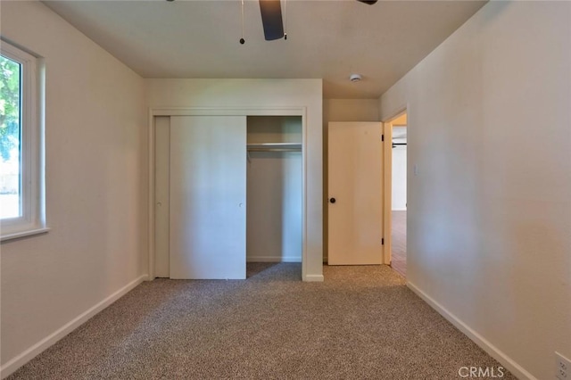 1101 Kensington Dr, Merced, CA 95340 - unfurnished bedroom featuring a closet, carpet, and ceiling fan