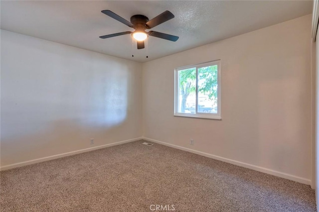 1101 Kensington Dr, Merced, CA 95340 - carpeted empty room featuring baseboards and a ceiling fan
