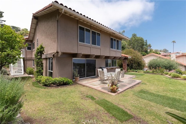 8 Via Subida, Rancho Palos Verdes, CA 90275 - back of property with a patio area, stucco siding, and a lawn