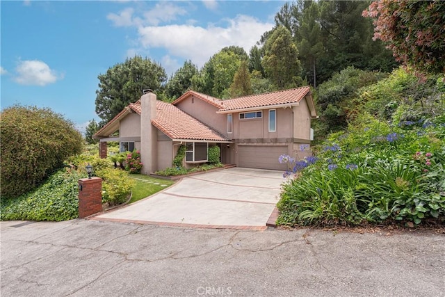 8 Via Subida, Rancho Palos Verdes, CA 90275 - mediterranean / spanish house with a chimney, a tile roof, driveway, a garage, and stucco siding