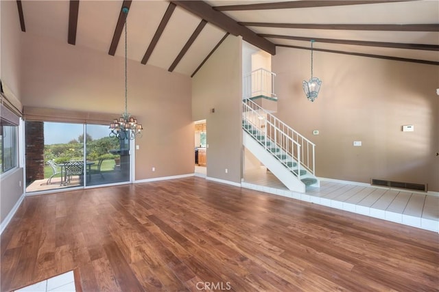 8 Via Subida, Rancho Palos Verdes, CA 90275 - unfurnished living room with a chandelier, wood finished floors, stairway, high vaulted ceiling, and beam ceiling