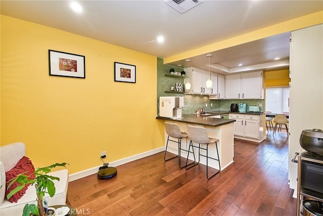 531 Juniper Way, La Habra, CA 90631 - kitchen featuring a peninsula, open shelves, dark countertops, white cabinets, and a breakfast bar area
