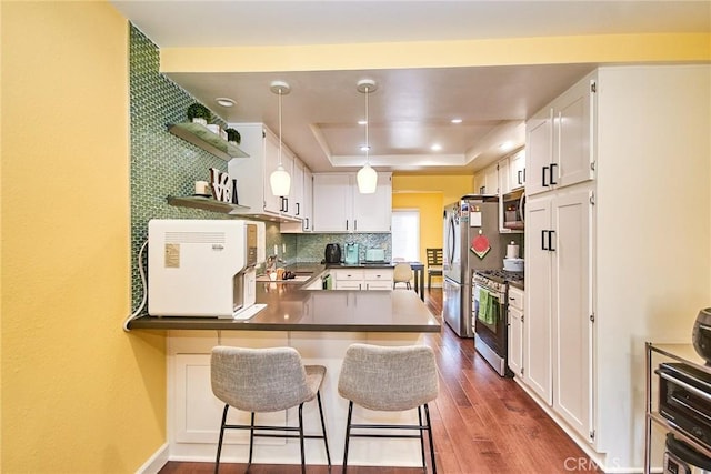 531 Juniper Way, La Habra, CA 90631 - kitchen featuring stainless steel appliances, a tray ceiling, dark wood-type flooring, open shelves, and white cabinets