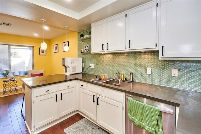 531 Juniper Way, La Habra, CA 90631 - kitchen featuring a peninsula, dishwashing machine, dark countertops, and white cabinetry