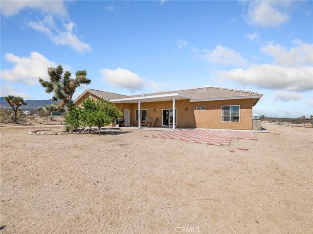11823 Wintergreen Rd, Pinon Hills, CA 92372 - back of property featuring stucco siding, a patio, and a tile roof