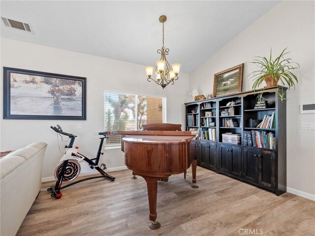 11823 Wintergreen Rd, Pinon Hills, CA 92372 - office area with light wood-style floors, a chandelier, and lofted ceiling