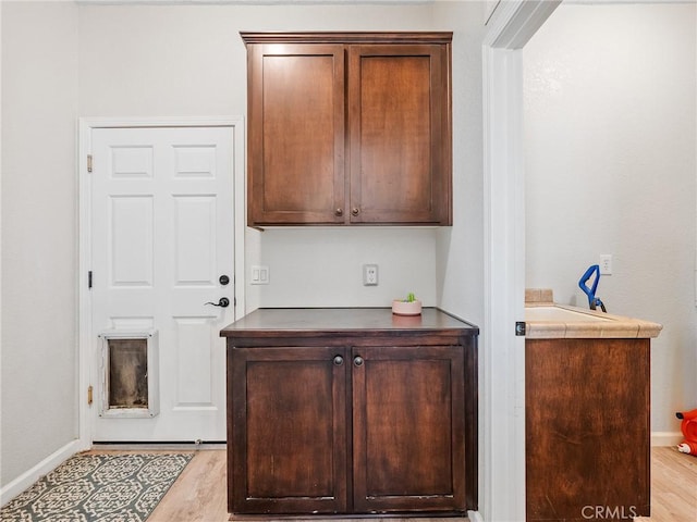11823 Wintergreen Rd, Pinon Hills, CA 92372 - bar featuring baseboards and light wood finished floors