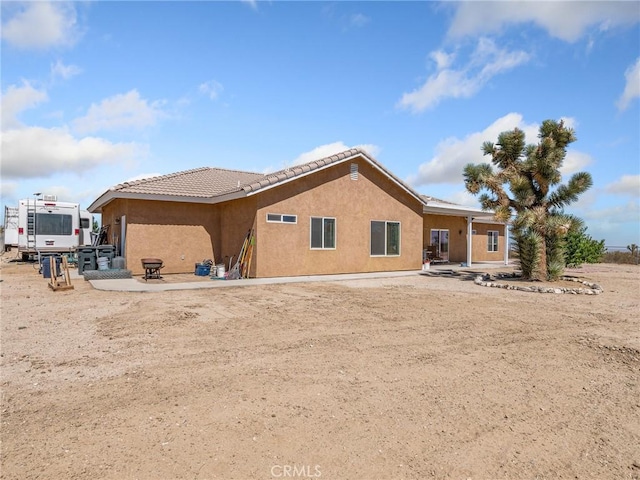 11823 Wintergreen Rd, Pinon Hills, CA 92372 - back of property with stucco siding and a tile roof