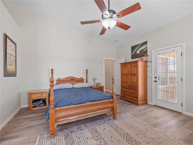 11823 Wintergreen Rd, Pinon Hills, CA 92372 - bedroom with access to exterior, light wood-type flooring, lofted ceiling, and ceiling fan