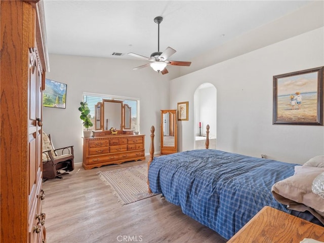 11823 Wintergreen Rd, Pinon Hills, CA 92372 - bedroom with arched walkways, wood finished floors, and a ceiling fan