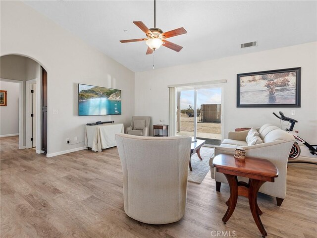 11823 Wintergreen Rd, Pinon Hills, CA 92372 - living room with ceiling fan, light wood finished floors, arched walkways, and high vaulted ceiling
