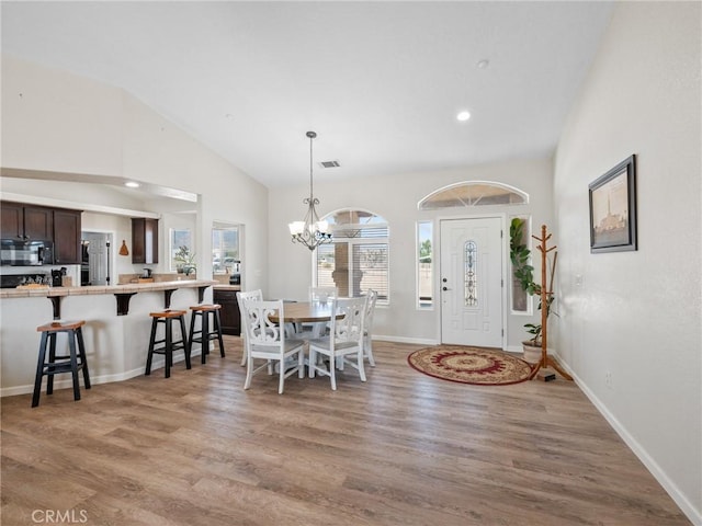 11823 Wintergreen Rd, Pinon Hills, CA 92372 - dining area featuring a chandelier, wood finished floors, recessed lighting, and high vaulted ceiling