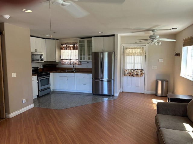 17412 Harrison Park Rd, Julian, CA 92036 - kitchen with appliances with stainless steel finishes, a ceiling fan, dark countertops, healthy amount of natural light, and recessed lighting