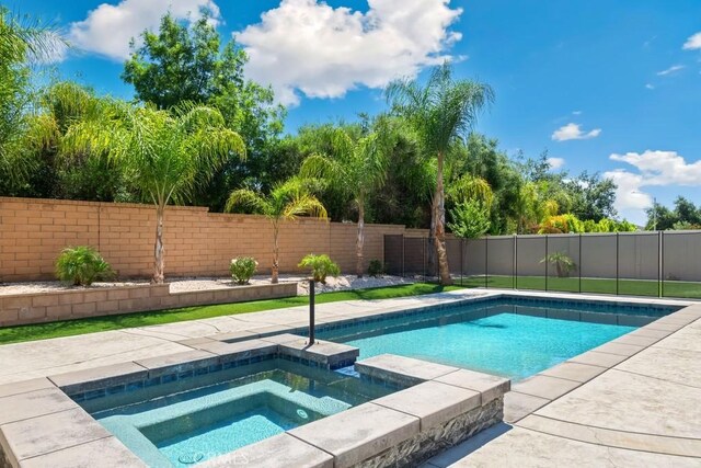 35676 Small Pine Ct, Winchester, CA 92596 - view of pool with a fenced backyard and a pool with connected hot tub