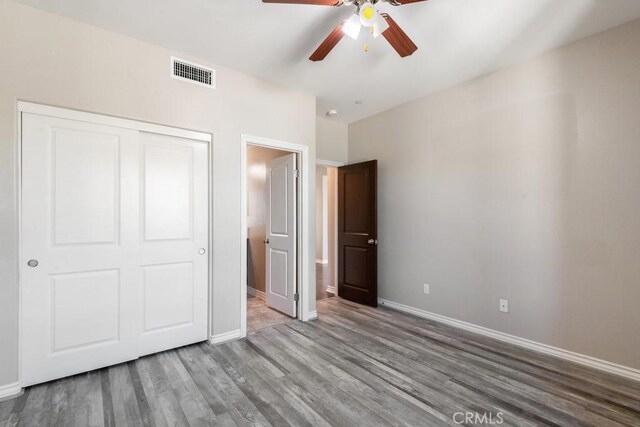 35676 Small Pine Ct, Winchester, CA 92596 - unfurnished bedroom featuring wood finished floors, a closet, and a ceiling fan