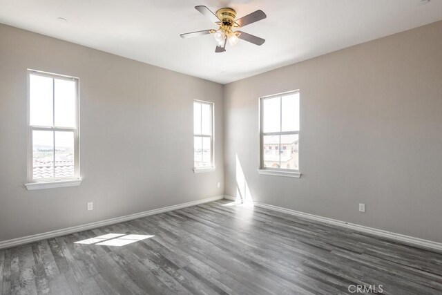 35676 Small Pine Ct, Winchester, CA 92596 - unfurnished room with dark wood finished floors and a ceiling fan