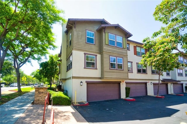 1180 Cornwell Dr, Fullerton, CA 92833 - townhome / multi-family property with stucco siding and a garage