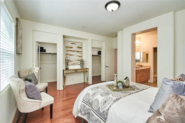 1180 Cornwell Dr, Fullerton, CA 92833 - bedroom with two closets, light wood-style floors, and ensuite bath