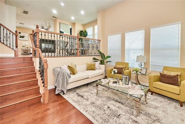 1180 Cornwell Dr, Fullerton, CA 92833 - living room featuring stairway, wood finished floors, and recessed lighting
