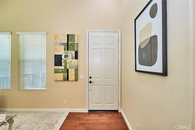 1180 Cornwell Dr, Fullerton, CA 92833 - entryway featuring baseboards and wood finished floors