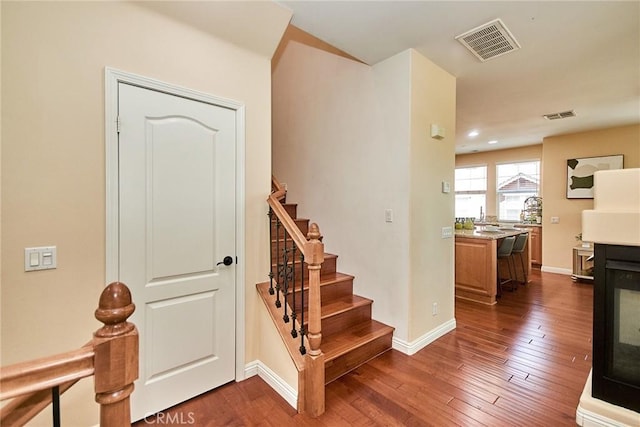 1180 Cornwell Dr, Fullerton, CA 92833 - stairway with wood-type flooring and recessed lighting