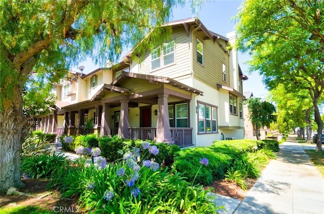 1180 Cornwell Dr, Fullerton, CA 92833 - view of front facade with stucco siding and covered porch