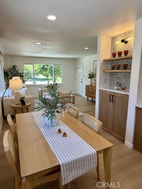 11117 Maidstone Ave, Norwalk, CA 90650 - dining room featuring light wood finished floors and recessed lighting