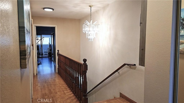 8467 Penfield Ave, Winnetka, CA 91306 - stairway featuring wood finished floors and a chandelier