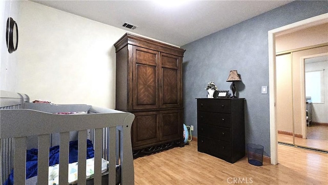 8467 Penfield Ave, Winnetka, CA 91306 - bedroom with light wood-style flooring