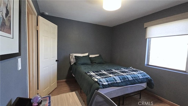 8467 Penfield Ave, Winnetka, CA 91306 - bedroom featuring wood finished floors and baseboards