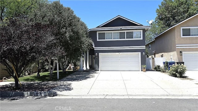 8467 Penfield Ave, Winnetka, CA 91306 - view of front of home with concrete driveway, an attached garage, and stucco siding
