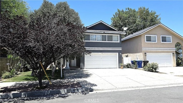 8467 Penfield Ave, Winnetka, CA 91306 - view of front of home with a garage, concrete driveway, and stucco siding