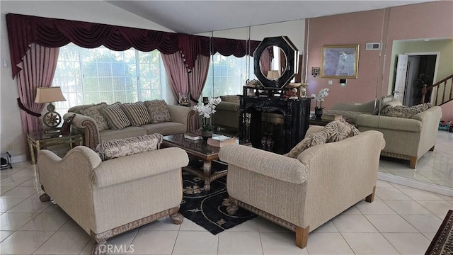 8467 Penfield Ave, Winnetka, CA 91306 - living area featuring light tile patterned floors and lofted ceiling