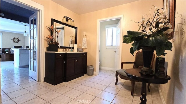 8467 Penfield Ave, Winnetka, CA 91306 - corridor featuring light tile patterned floors and baseboards