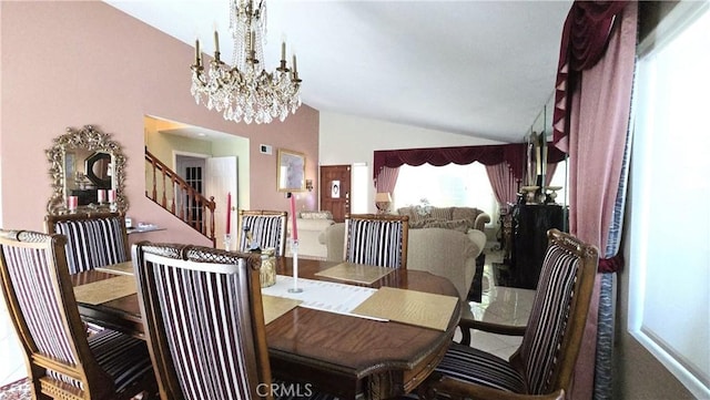8467 Penfield Ave, Winnetka, CA 91306 - dining room with lofted ceiling, a chandelier, and stairway