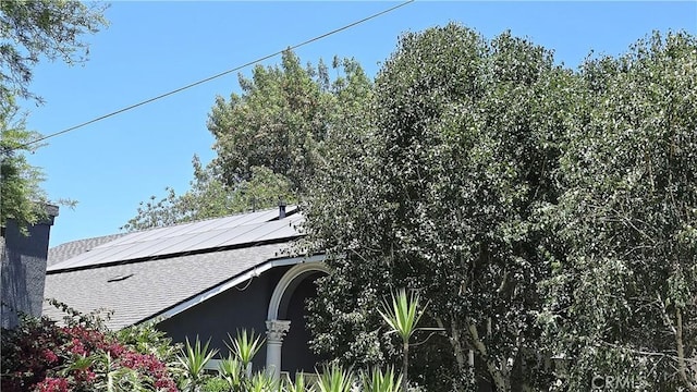 8467 Penfield Ave, Winnetka, CA 91306 - exterior view of roof with shingles and a chimney