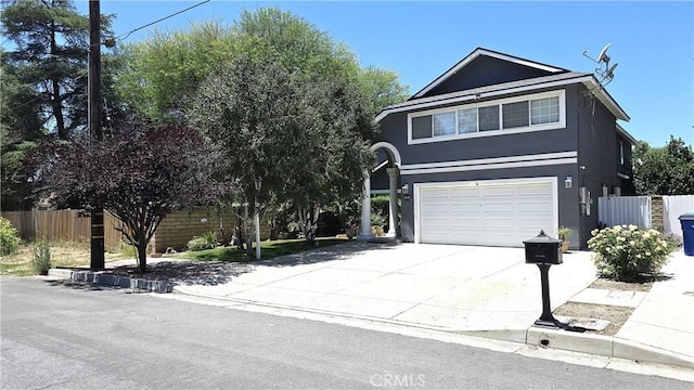 8467 Penfield Ave, Winnetka, CA 91306 - view of front of house featuring an attached garage, driveway, and stucco siding