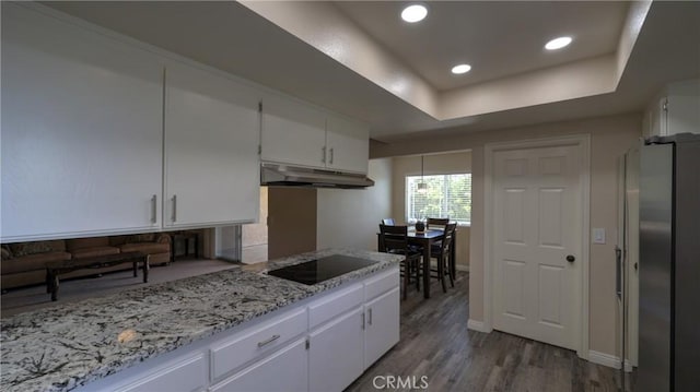 108 Limestone Rd, Claremont, CA 91711 - kitchen featuring under cabinet range hood, freestanding refrigerator, black electric cooktop, white cabinetry, and recessed lighting