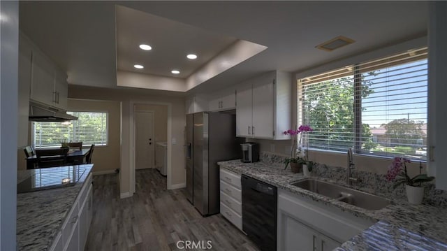 108 Limestone Rd, Claremont, CA 91711 - kitchen featuring black dishwasher, under cabinet range hood, light wood-style floors, white cabinets, and a raised ceiling