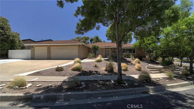 108 Limestone Rd, Claremont, CA 91711 - ranch-style house featuring an attached garage, driveway, and stucco siding