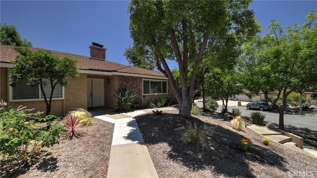 108 Limestone Rd, Claremont, CA 91711 - view of front of home with a chimney and stucco siding