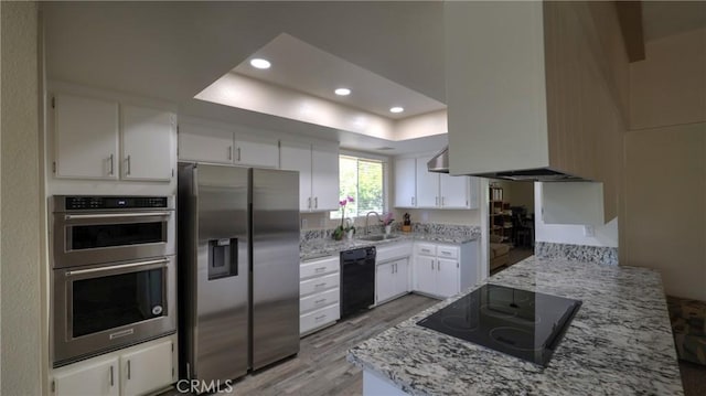 108 Limestone Rd, Claremont, CA 91711 - kitchen featuring black appliances, white cabinetry, a tray ceiling, light wood finished floors, and recessed lighting