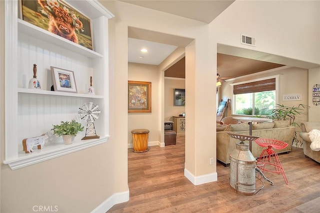 14182 Whitebark Ave, Chino, CA 91710 - corridor featuring wood finished floors and baseboards