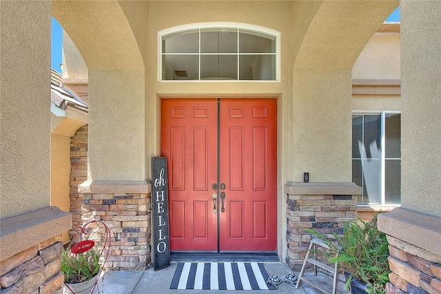 14182 Whitebark Ave, Chino, CA 91710 - doorway to property featuring stucco siding and stone siding